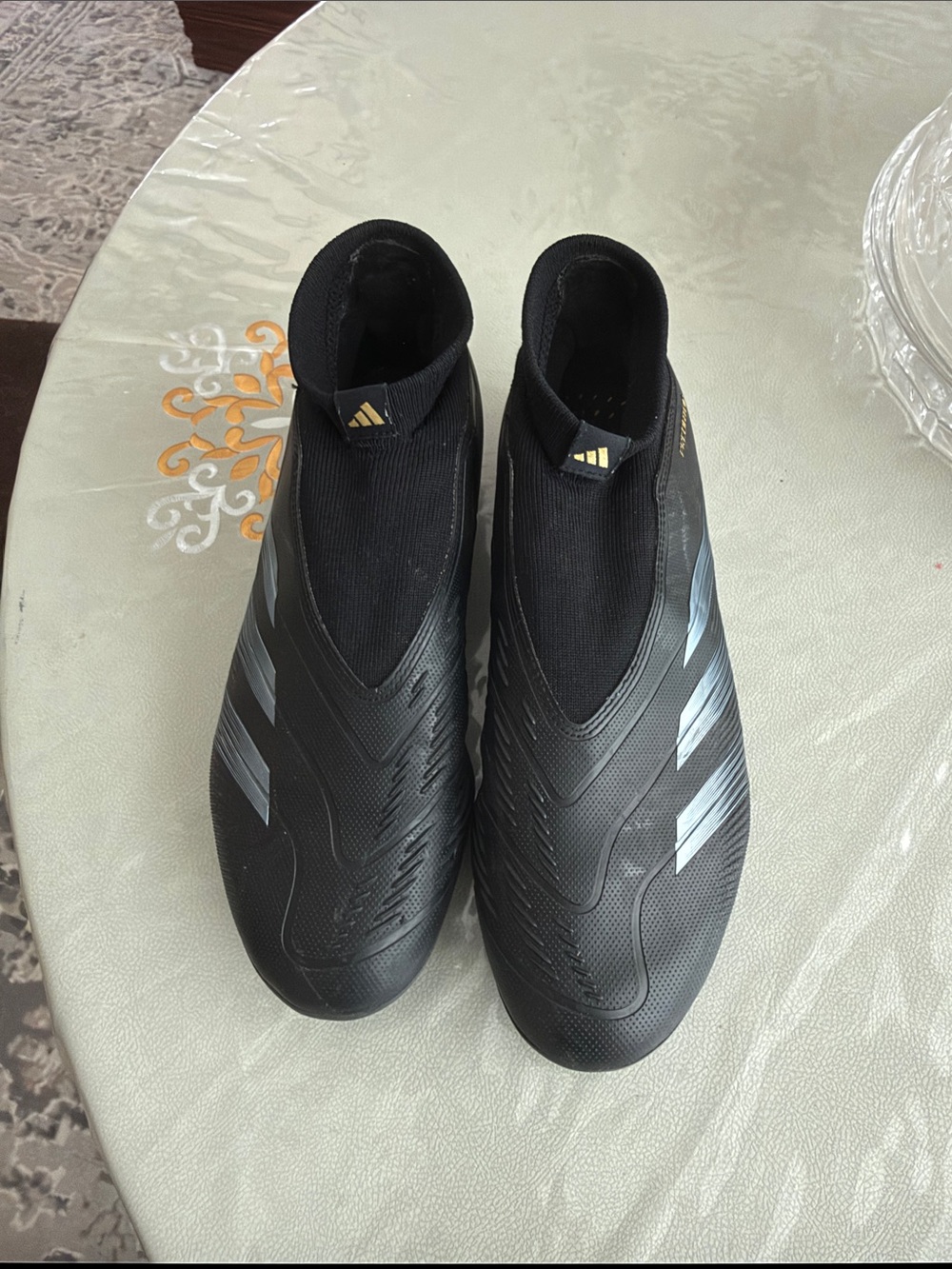 adidas Men’s Black Slip-On Laceless Athletic Soccer Shoes with Silver Stripes